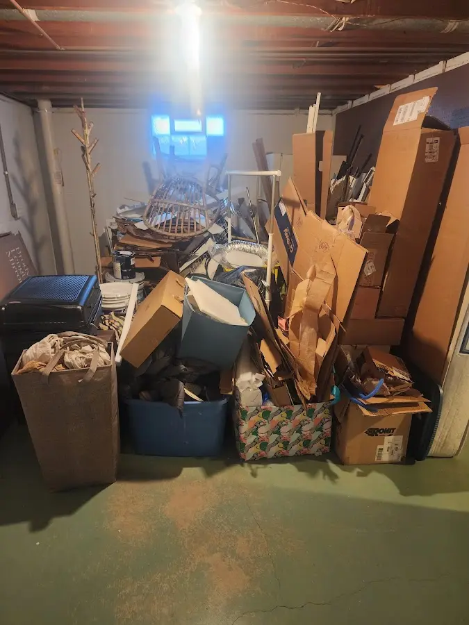 Roll-off dumpster container at job site for 15 Yard Dumpster Rental in Quitman