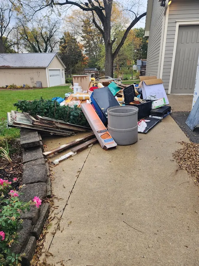 Dumpster being loaded with debris for Residential Dumpster Rental in Quitman